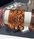 Grossiste de bracelets Bouddhistes torsadé avec des feuilles d'or
